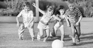 children playing with a ball on the field.